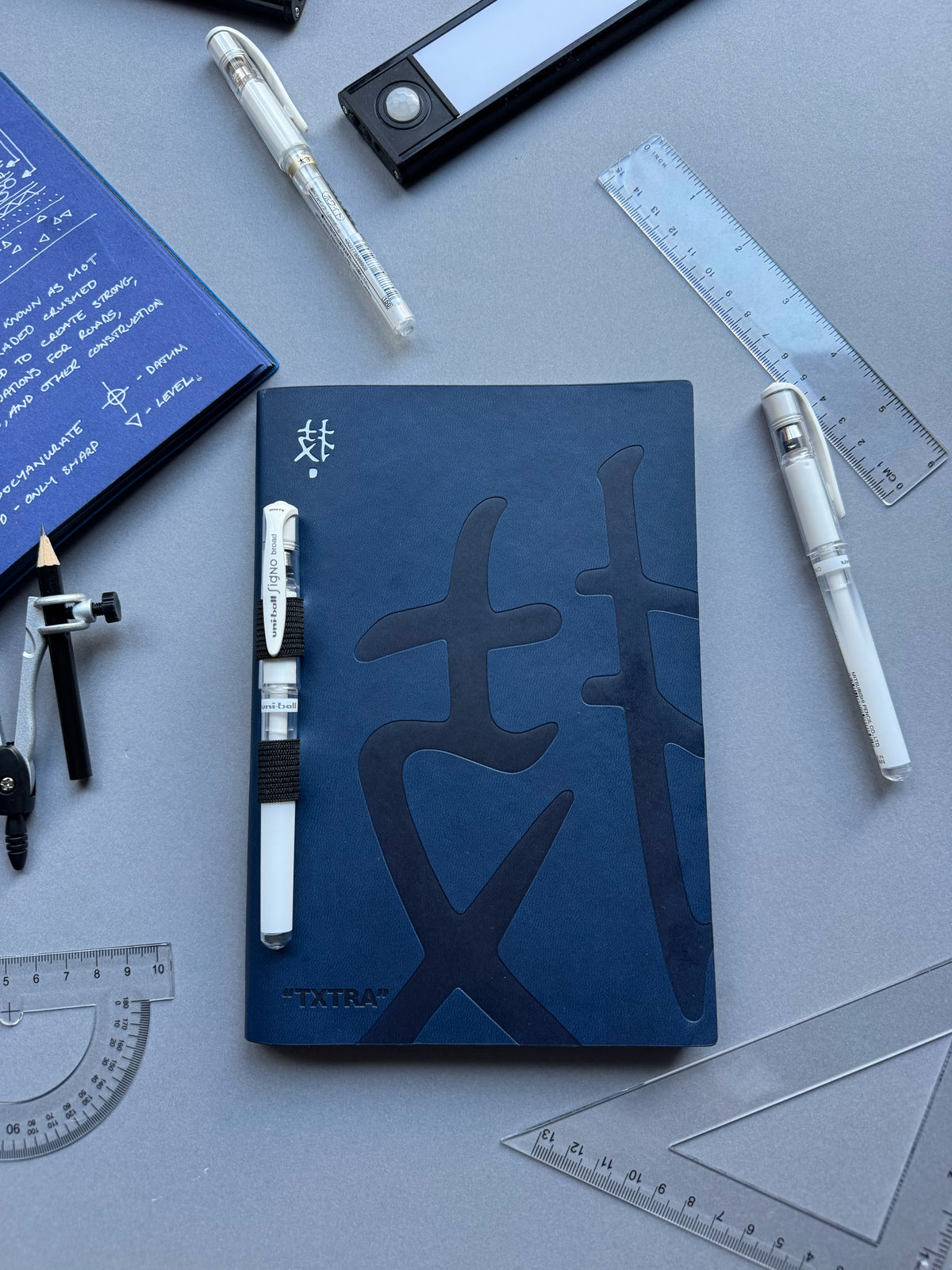 “TXTRA” notebook + pen